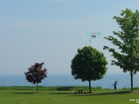 10389CrLe - Flying the airplane kite with Andrew at Rotary Park   Each New Day A Miracle  [  Understanding the Bible   |   Poetry   |   Story  ]- by Pete Rhebergen
